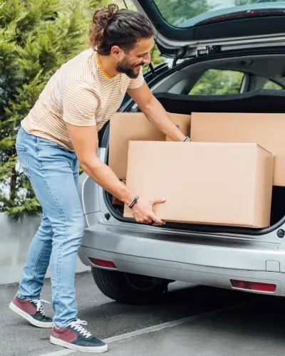 Man loading his car with boxes